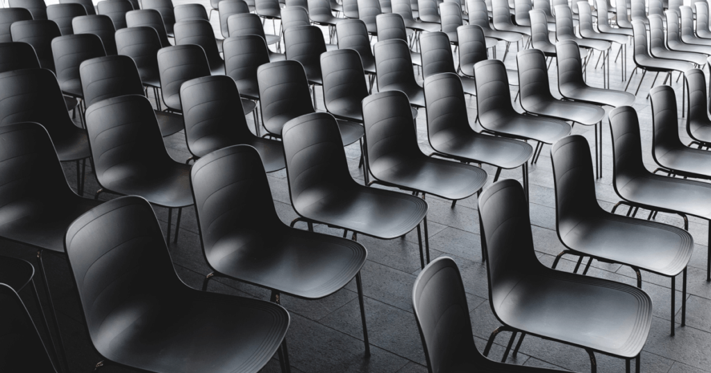 Articles about education today as represented by a classroom with seating neatly arranged.