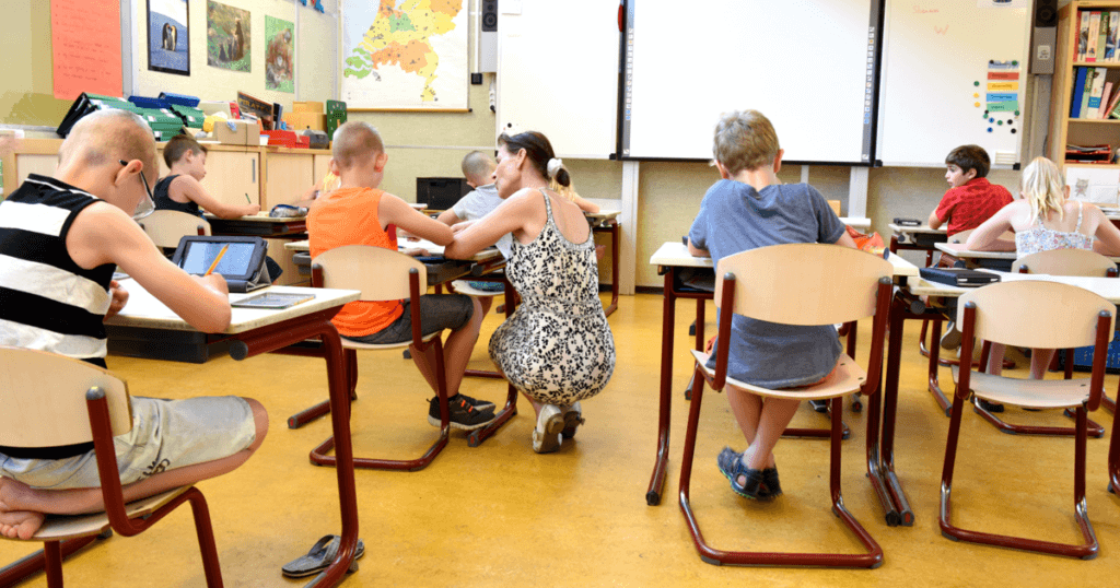 A teacher giving differentiated instruction to a student.