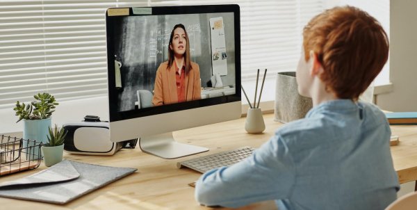 A teacher doing a video check-in with her student.