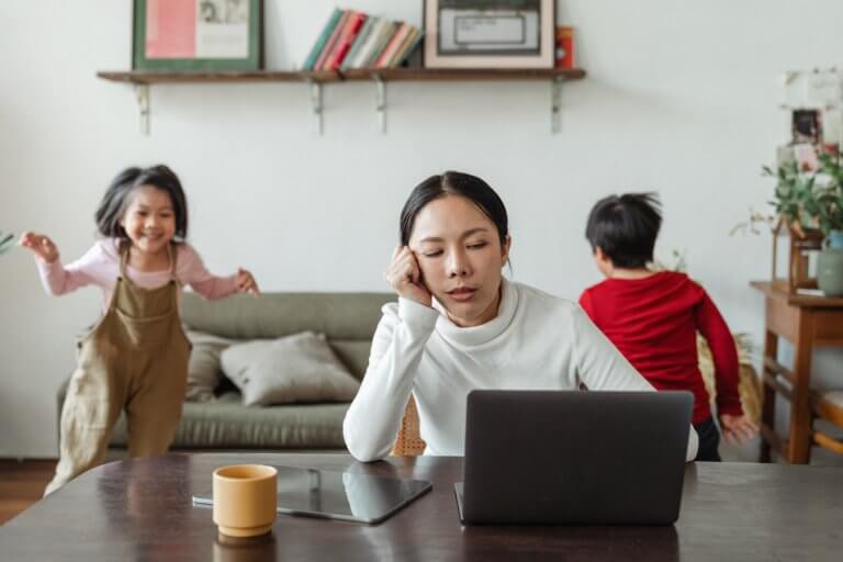 Kids are distracted while a guardian attempts to get them to focus on their online studies.